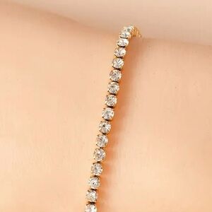 Tennis Bracelet Featuring Rhinestones Set In 18K Gold Plated Stainless Steel